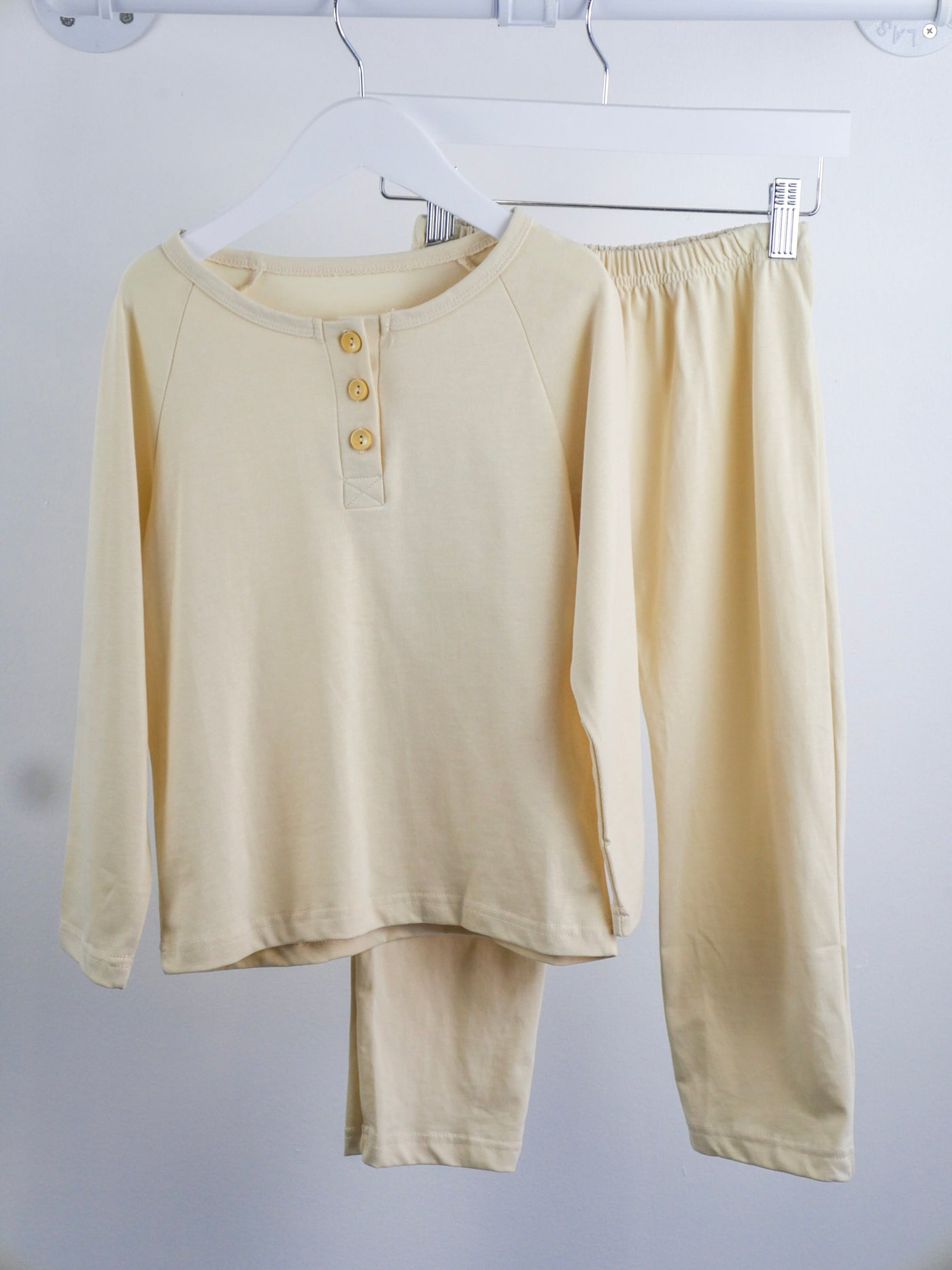 Beige light weight shirt with long sleeves and matching pants with elastic waist