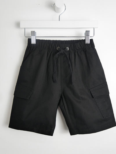Black cotton cargo shorts with a funtional drawstring waist and large pockets on both legs