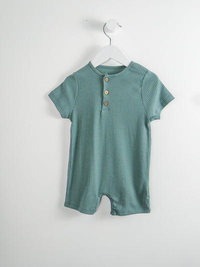 Organic cotton green romper with snap closures around legs and 3 fuctional button down the front.